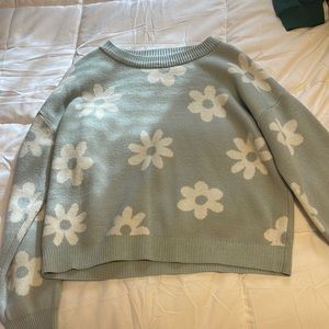 A woman’s sweater with flowers